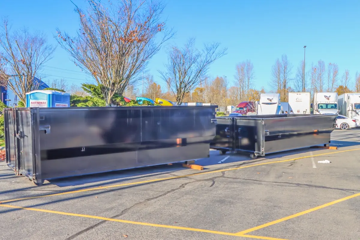 Professional dumpster rental service with roll-off container on residential driveway in Seffner